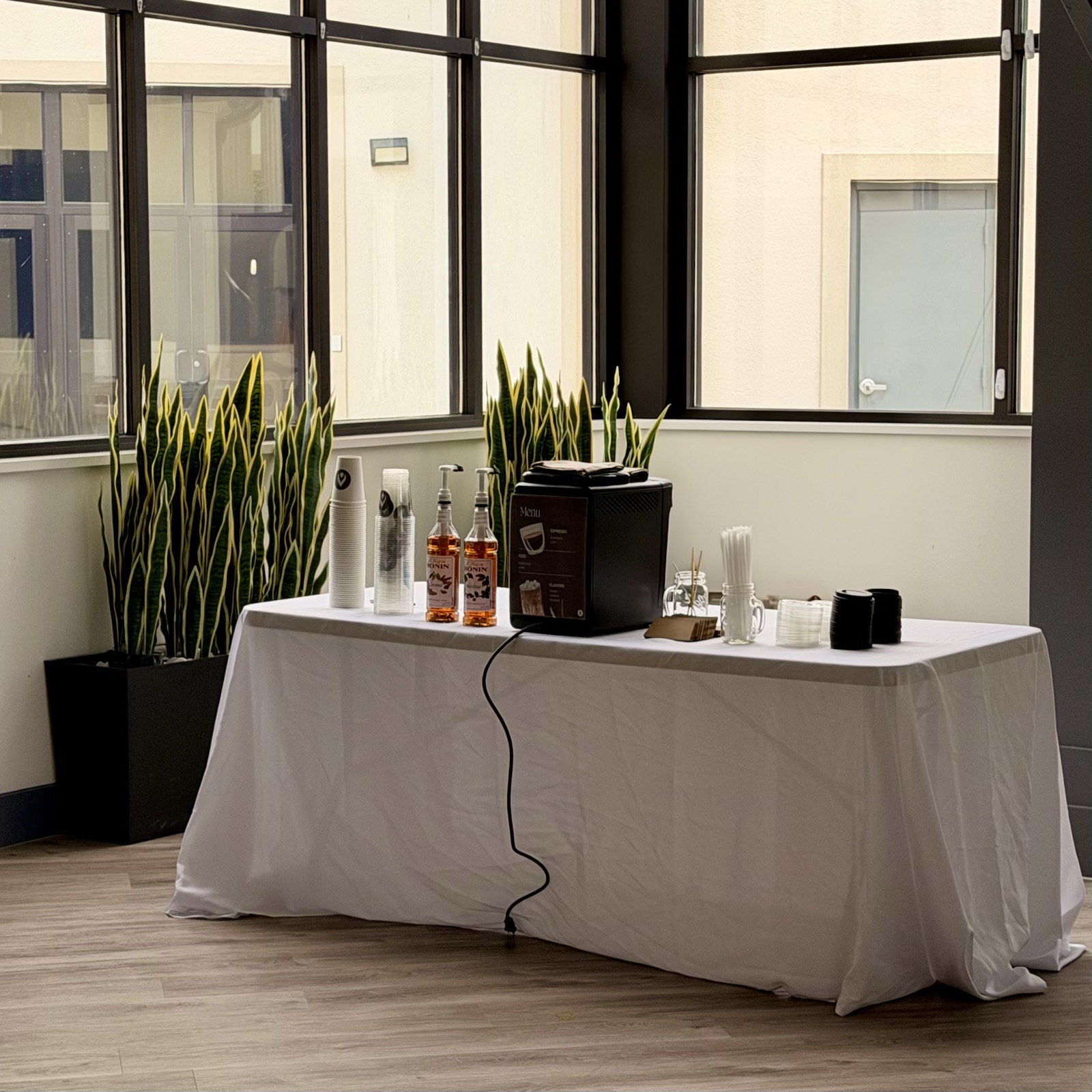 The Philly Cafe coffee station set up by the windows